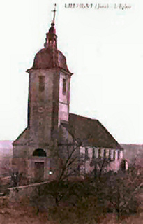 L'église de Chevigny au début du XXème siècle avec son clocher à l'impériale